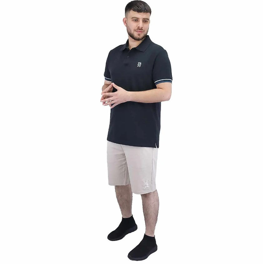 قميص بولو قطني بيكيه بياقة محبوكة مسطحة وأكمام قصيرة مطرزة بلون موحد (قميص بولو رياضي)