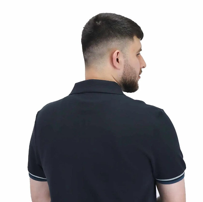 قميص بولو قطني بيكيه بياقة محبوكة مسطحة وأكمام قصيرة مطرزة بلون موحد (قميص بولو رياضي)