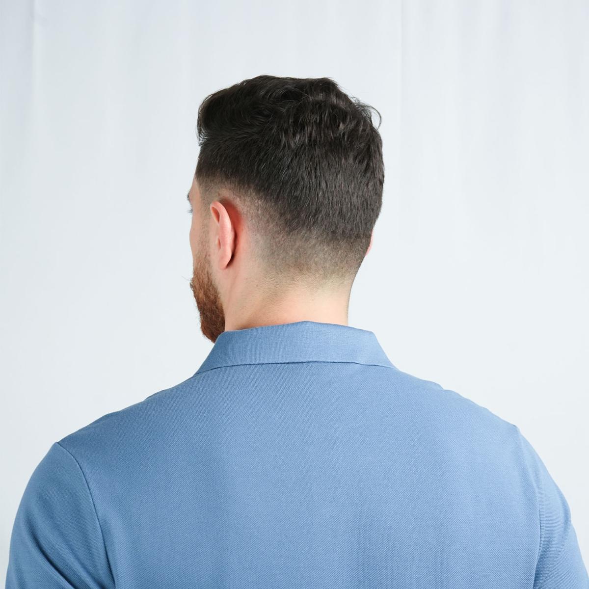 قميص بولو قطني بيكيه بياقة محبوكة مسطحة وأكمام قصيرة مطرزة بلون موحد (قميص بولو رياضي)