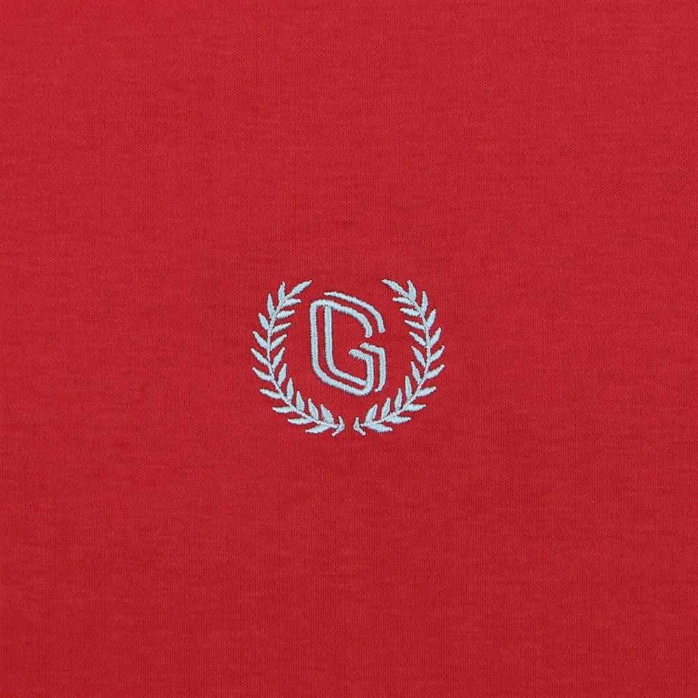 قميص بولو قطني محبوك مسطح بياقة وأكمام قصيرة وتطريز ضيق بلون سادة (ملمس سائل)