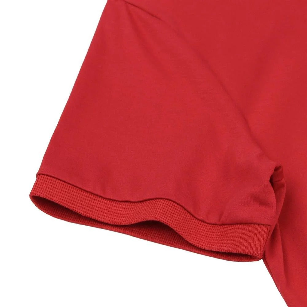 قميص بولو قطني محبوك مسطح بياقة وأكمام قصيرة وتطريز ضيق بلون سادة (ملمس سائل)