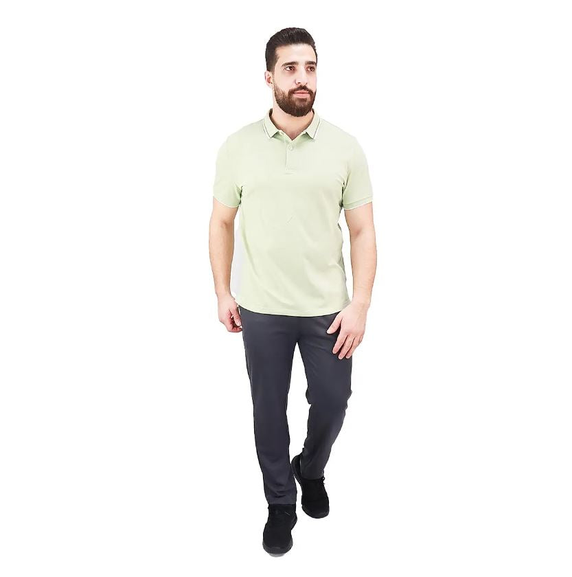 قميص بولو قطني/ليكرا بيكيه بياقة محبوكة وأكمام قصيرة وقصة ضيقة بلون موحد